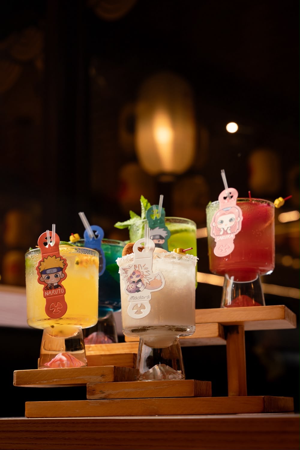 Flight of signature Naruto SXM anime cocktails on wooden stands