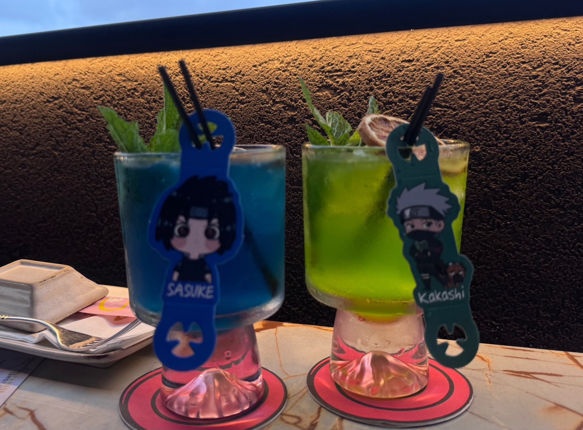 Anime cocktails on the terrace at golden hour in Sint Maarten